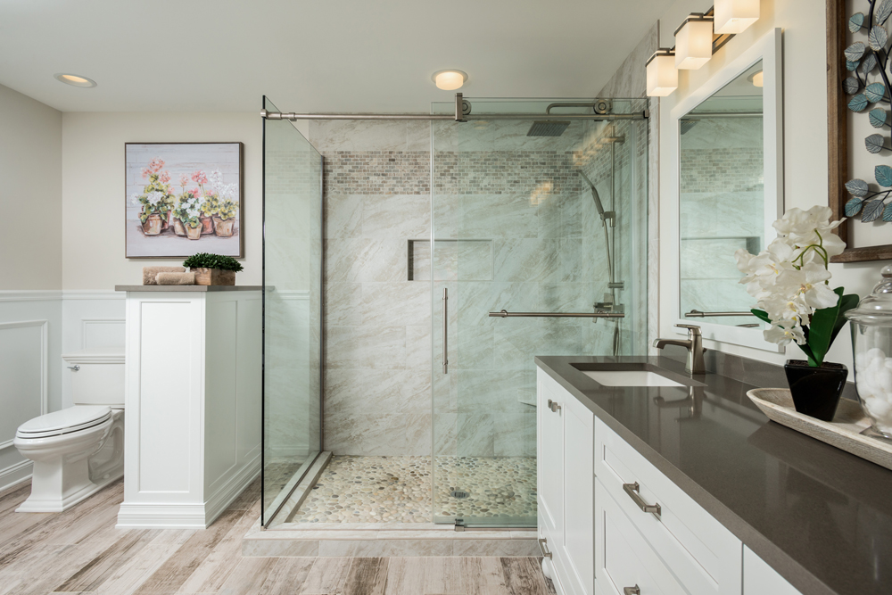 brown and grey bathroom with glass shower